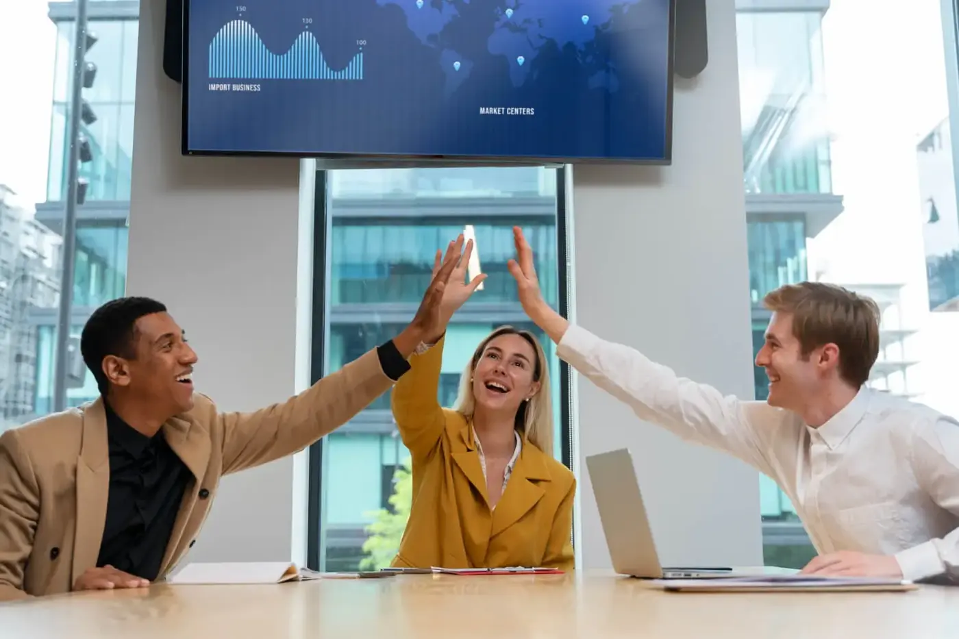 Colleagues celebrating in a modern office