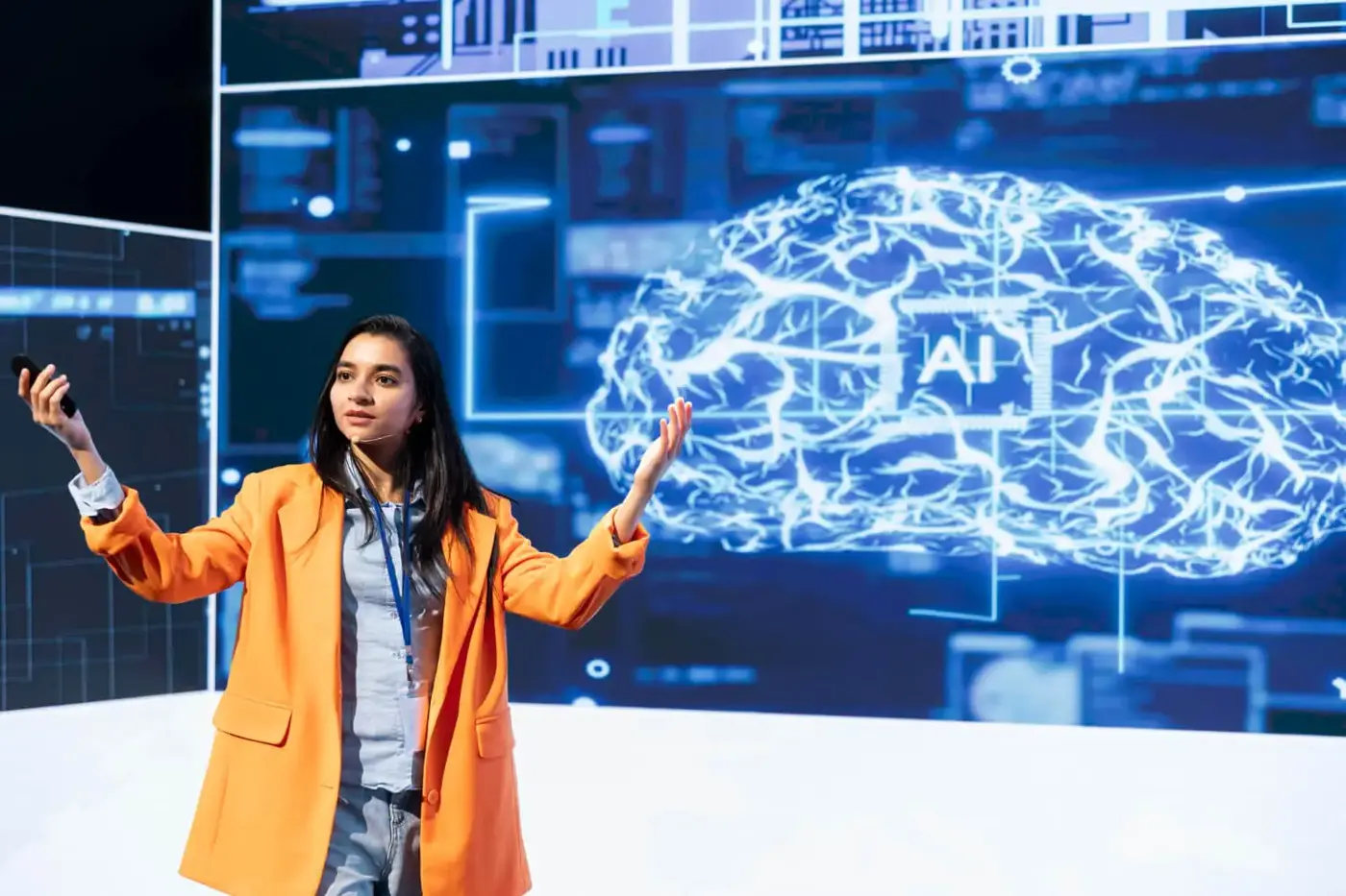 Presenter in front of a screen illustrating AI